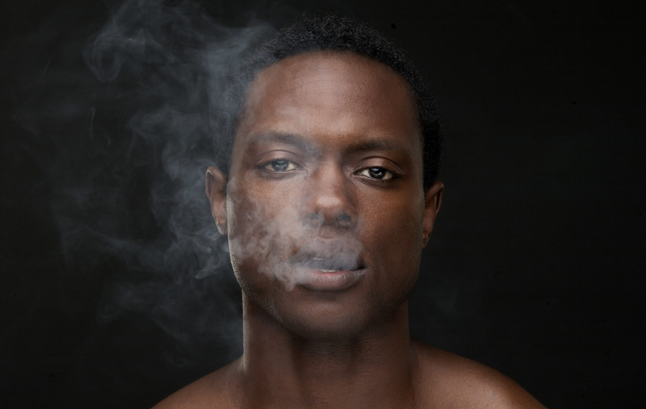 african-american-man-with-smoke-coming-out-mouth-2023-11-27-05-32-12-utc-min